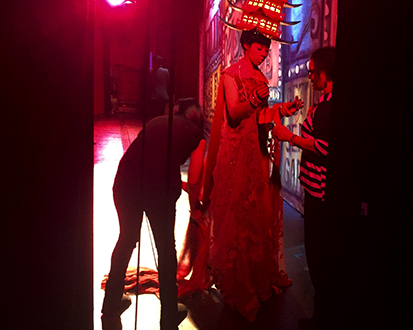 backstage on Broadway, fixing a costume