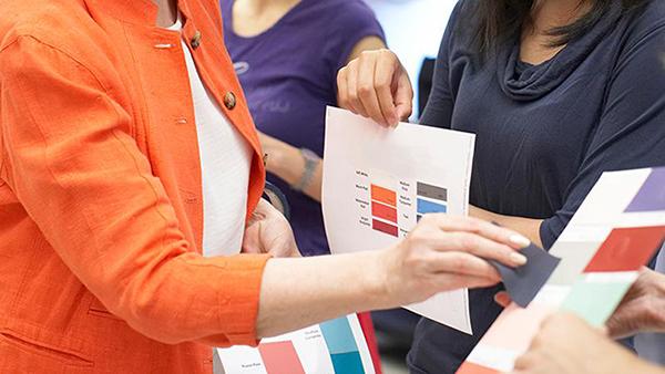 students looking at color swatches